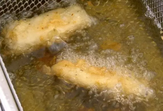 Frying fish and chips in high cooking point oil.