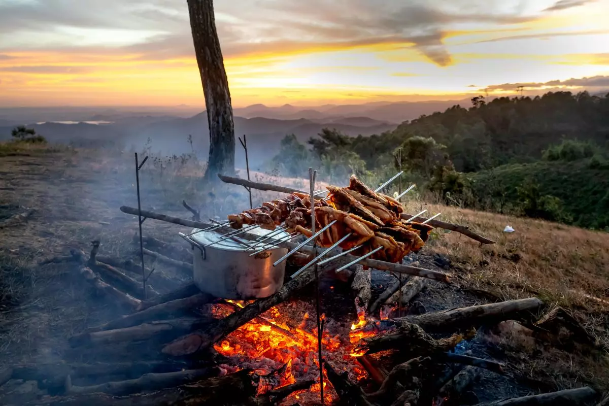 Cooking food outdoors.